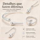 Conjunto de joias em formato de gota, composto por quatro peças em ouro ou prata: brincos, colar, pulseira e anel.